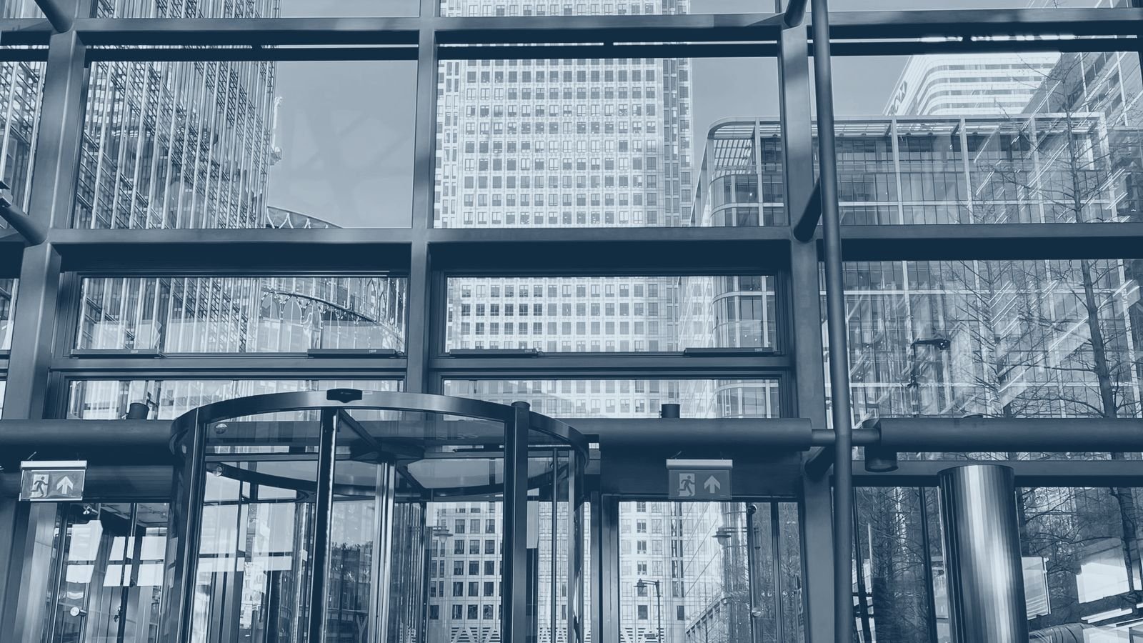 A modern commercial office tower entrance and glass facade